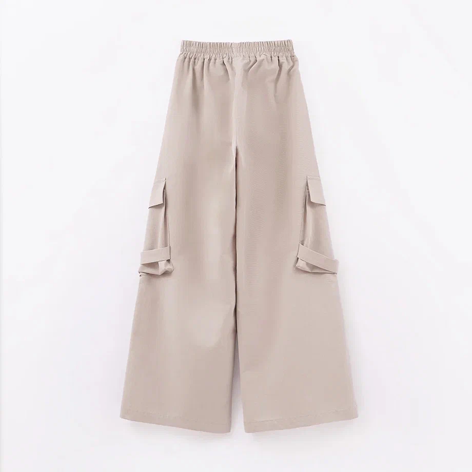 Бежевые брюки с карманами для девочки купить