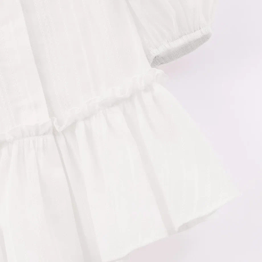 Молочная блузка с баской для девочки фото